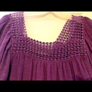 Eggplant colored wide sleeve top with lovely detail at the neck.  Size S